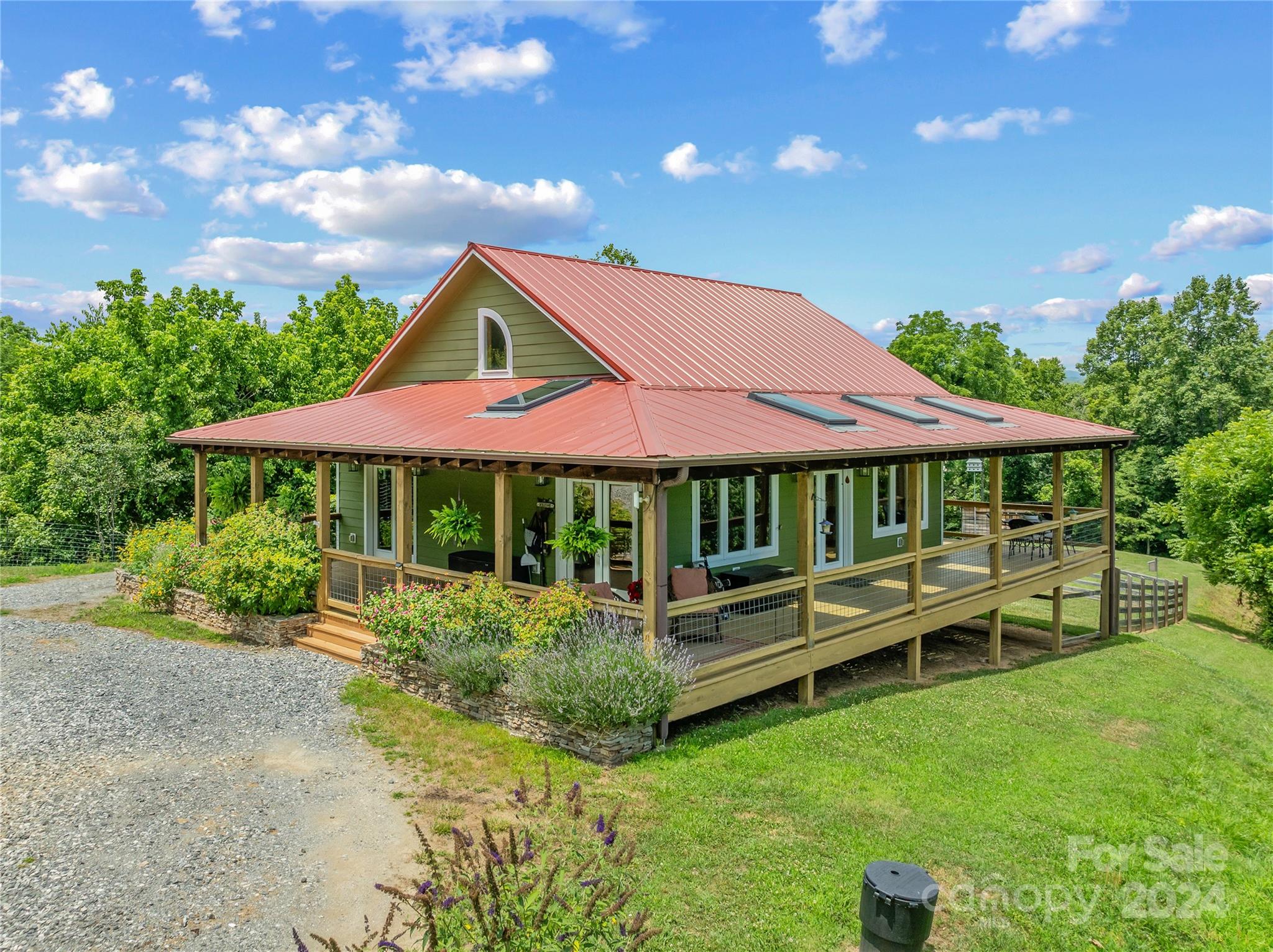 329 Cabin Hollow Drive Marshall, NC 28753 - Photo 33 of 40 a backyard of a house with swing and outdoor seating