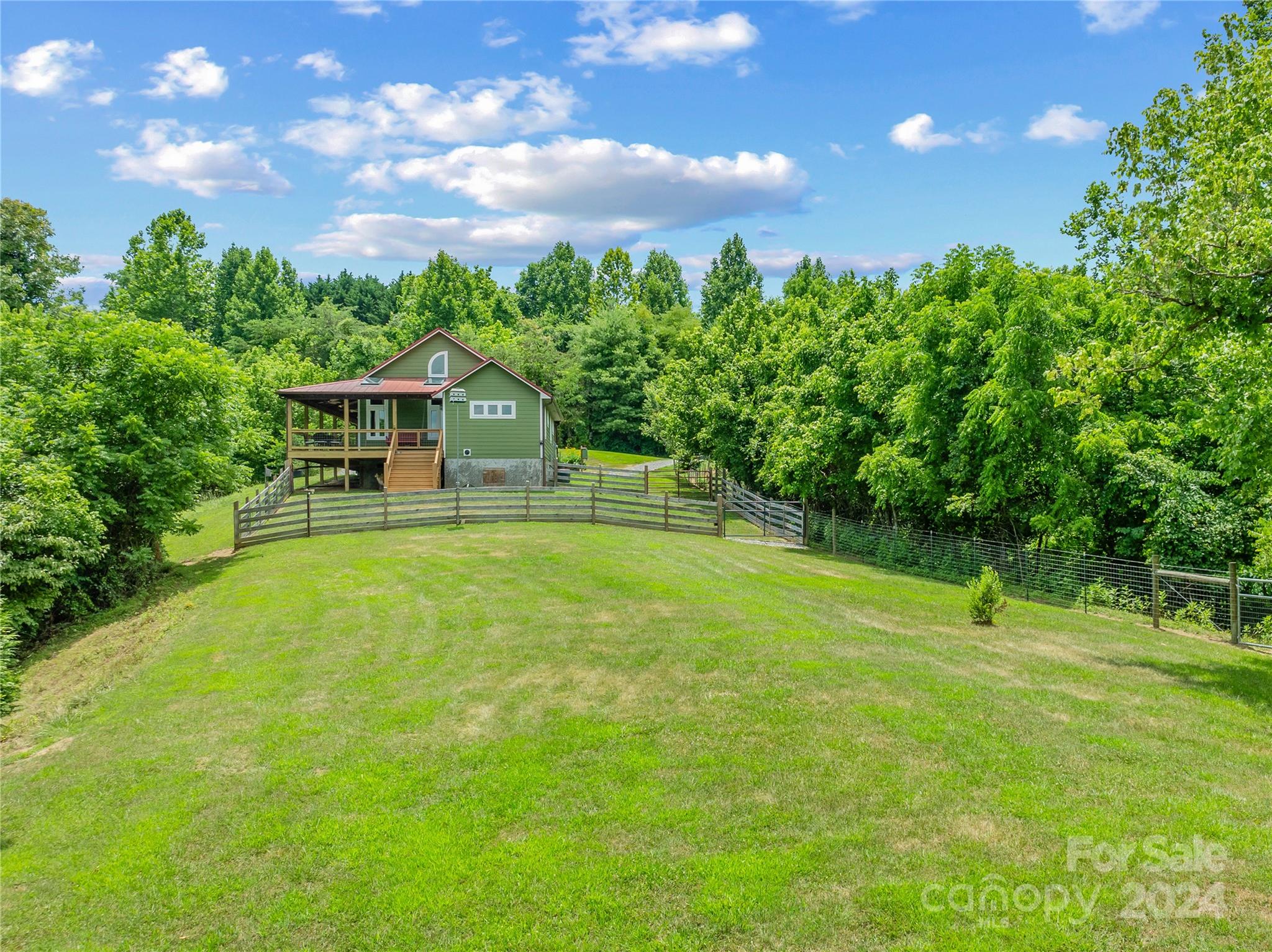 329 Cabin Hollow Drive Marshall, NC 28753 - Photo 36 of 40 a house view with a garden space