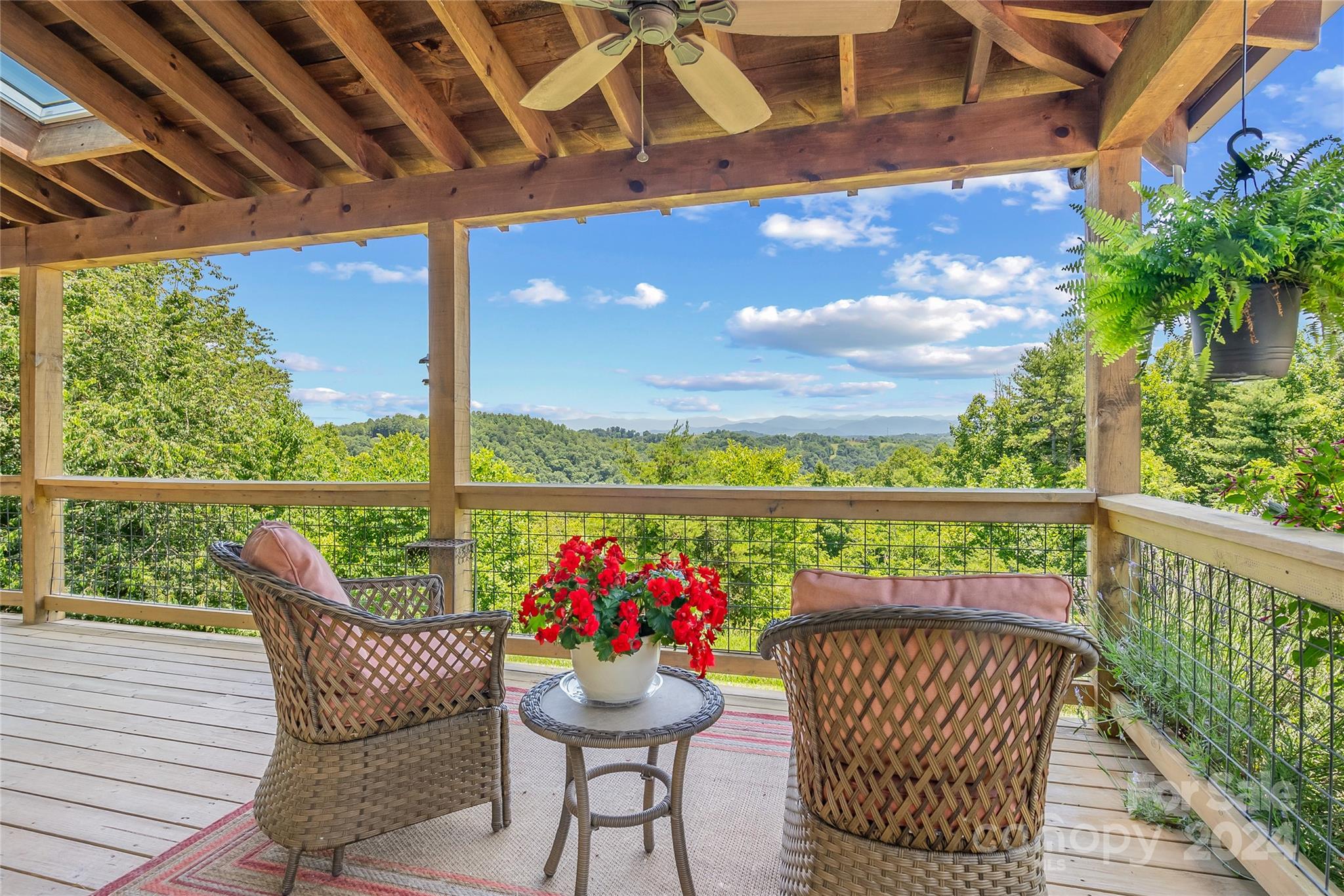329 Cabin Hollow Drive Marshall, NC 28753 - Photo 4 of 40 a view of two chairs in a balcony