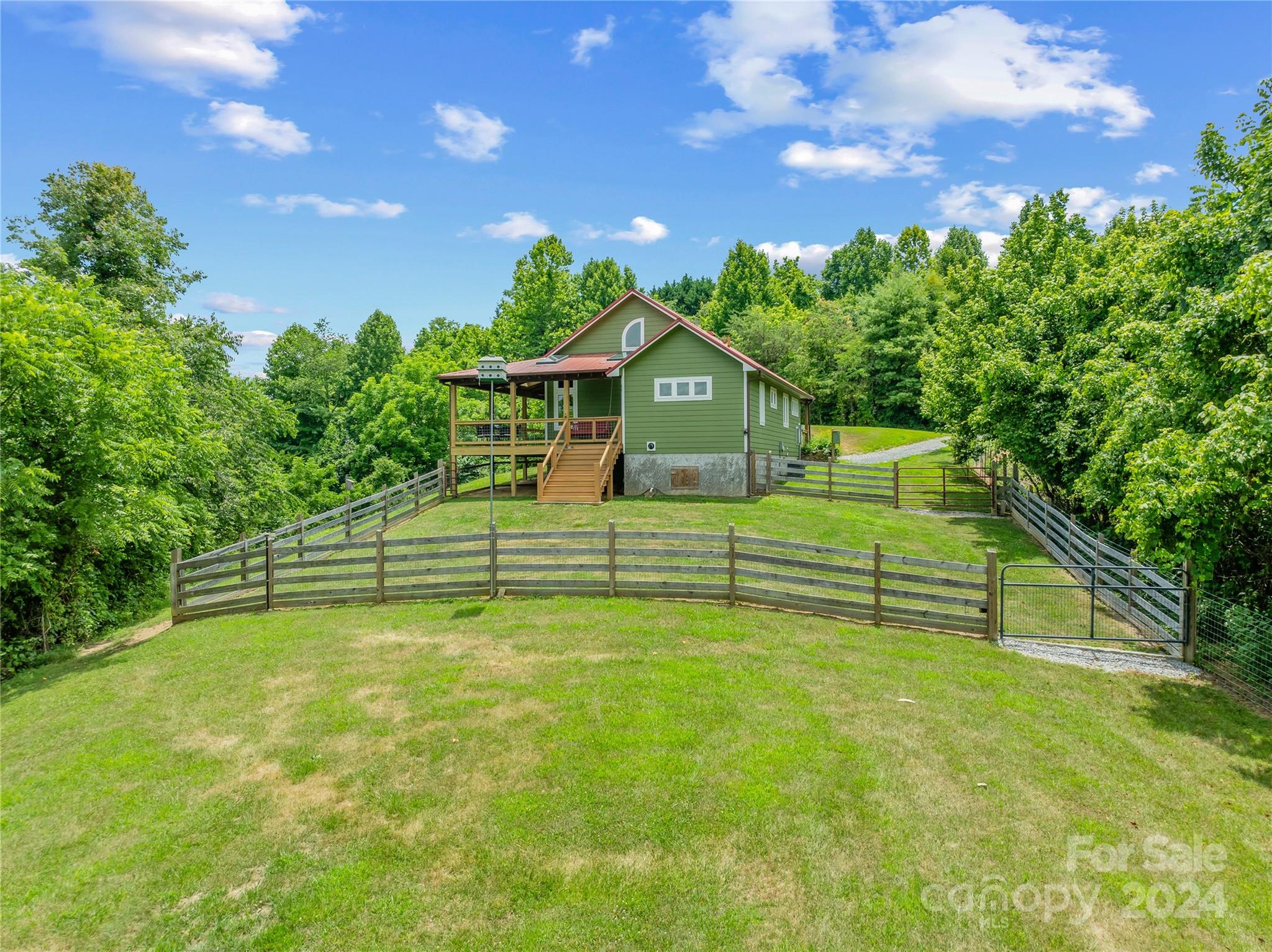 329 Cabin Hollow Drive Marshall, NC 28753 - Photo 7 of 40 a view of a house with a backyard