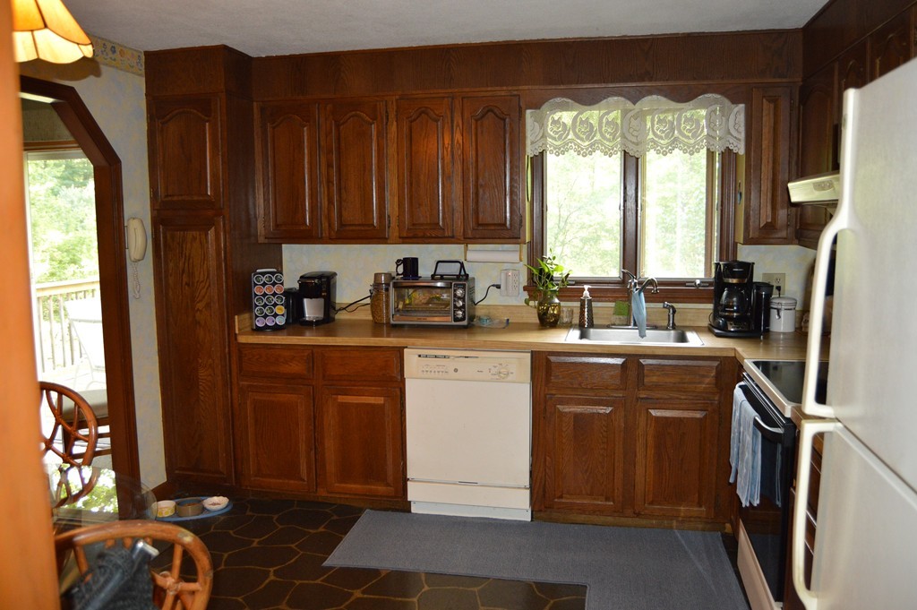 382 East County Road Rutland, MA 01543 - Photo 3 of 19 a kitchen with stainless steel appliances granite countertop a refrigerator sink and cabinets