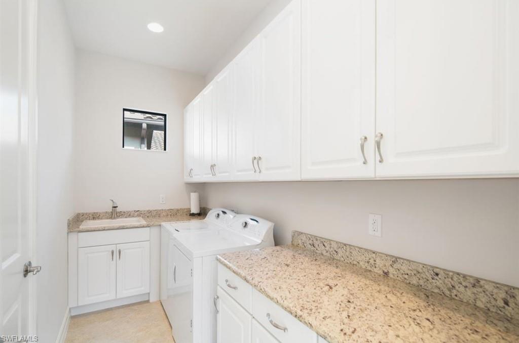 7606 Trento Circle Naples, FL 34113 - Photo 24 of 28 a room with a sink and cabinets