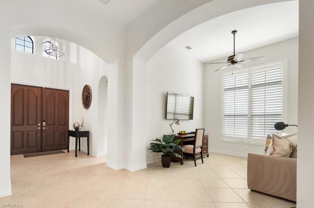 7606 Trento Circle Naples, FL 34113 - Photo 3 of 28 a living room with furniture and wooden floor