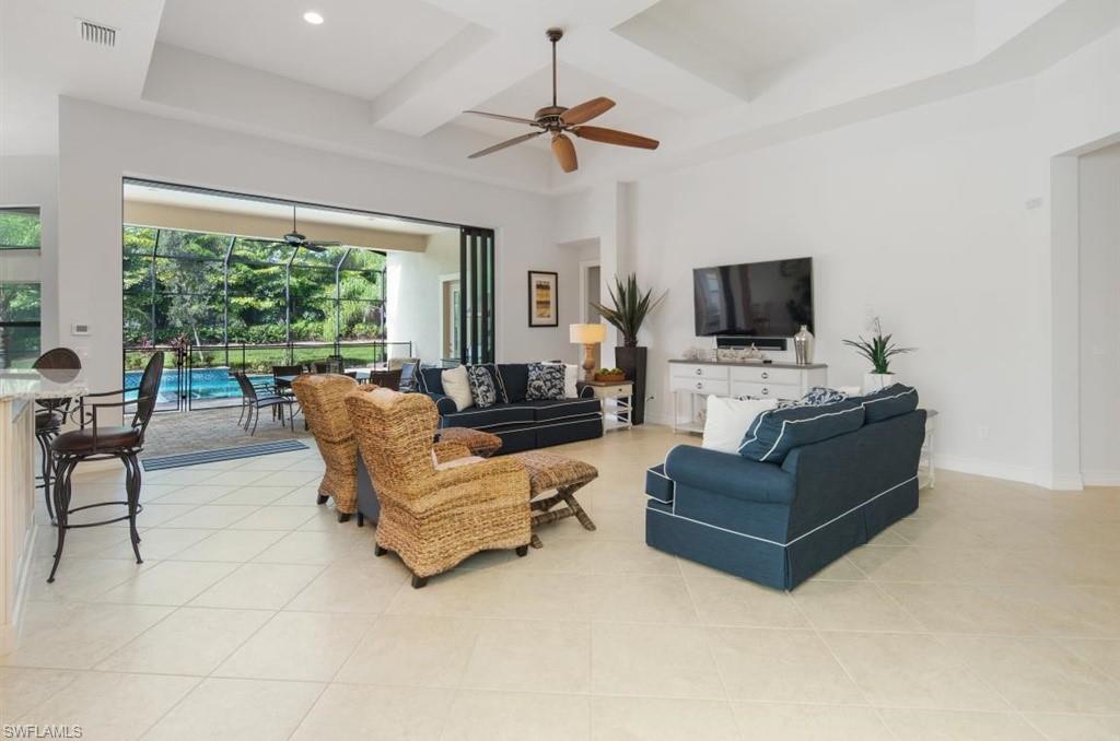 7606 Trento Circle Naples, FL 34113 - Photo 4 of 28 a living room with furniture and a flat screen tv