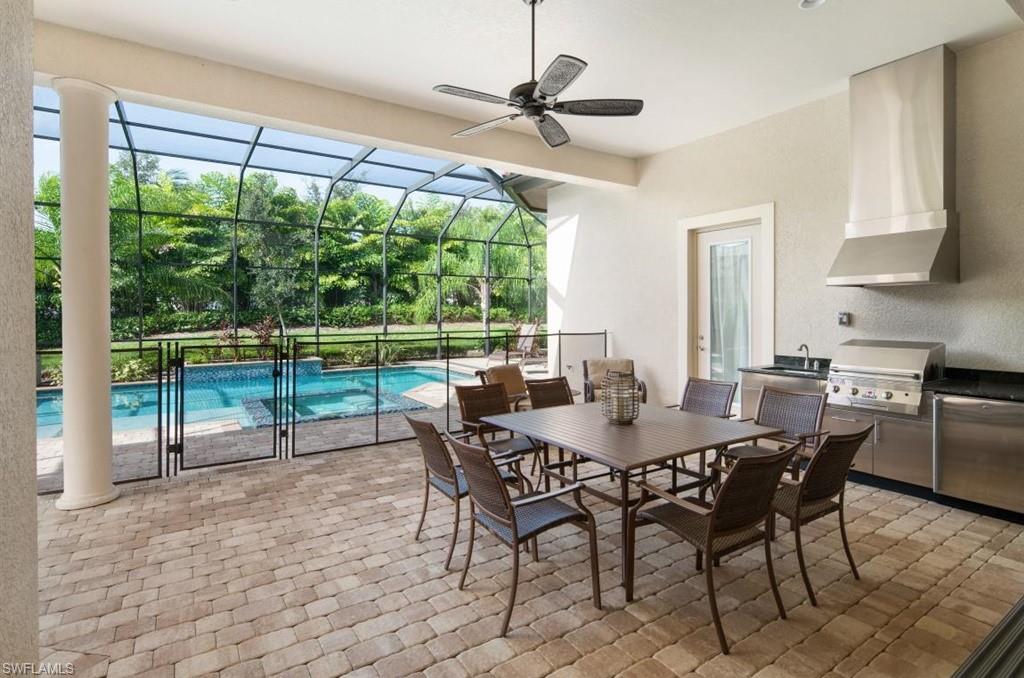 7606 Trento Circle Naples, FL 34113 - Photo 7 of 28 a view of a dining room with furniture window and outside view