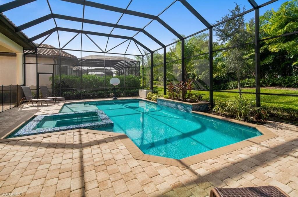 7606 Trento Circle Naples, FL 34113 - Photo 8 of 28 a view of a swimming pool with a patio