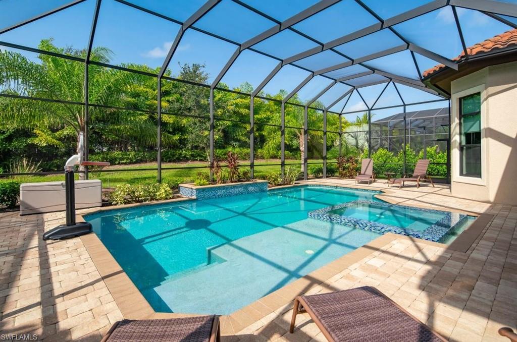 7606 Trento Circle Naples, FL 34113 - Photo 9 of 28 a view of a backyard with swimming pool