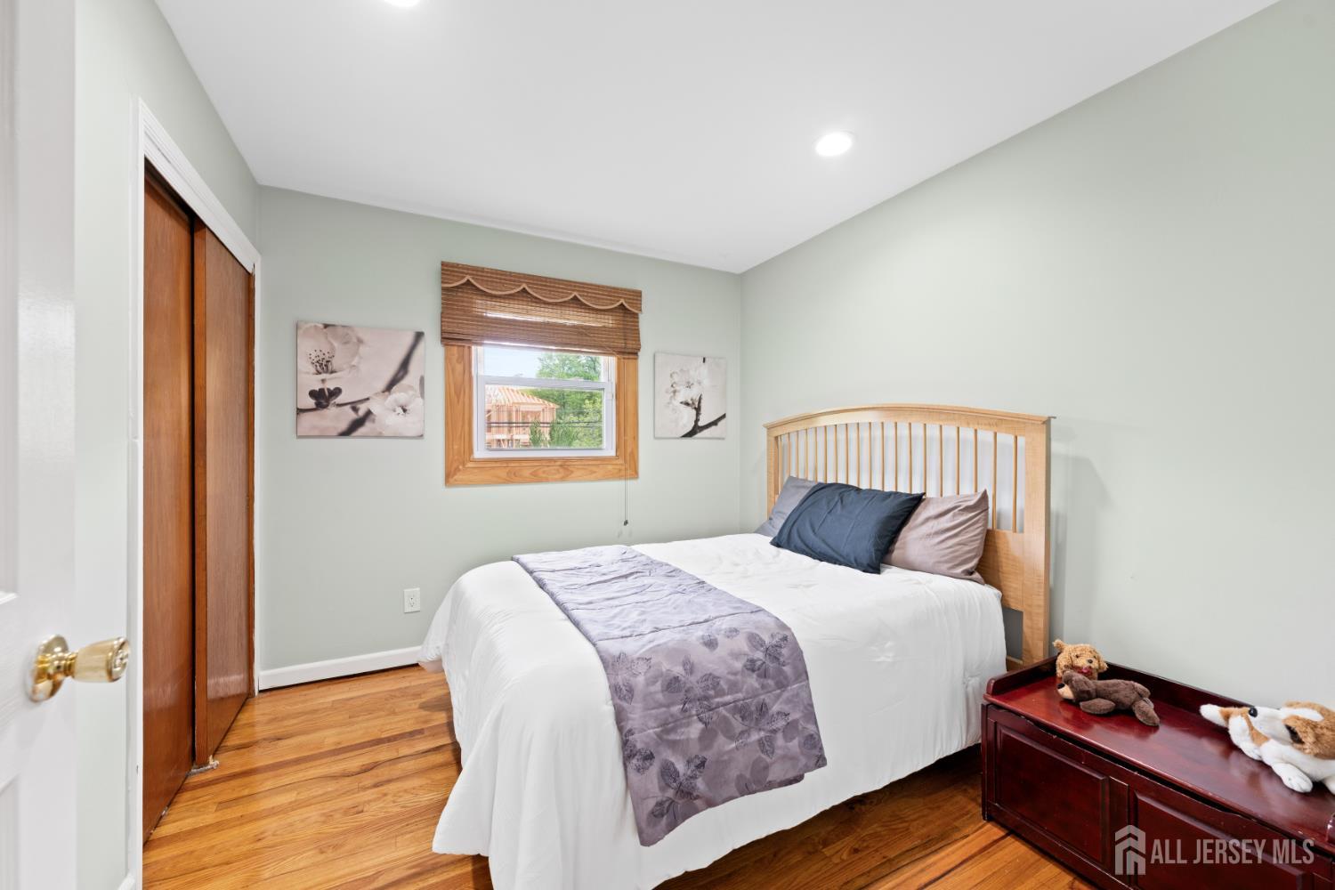 13 Fishel Road Edison, NJ 08820 - Photo 15 of 31 a bedroom with a bed and wooden floor