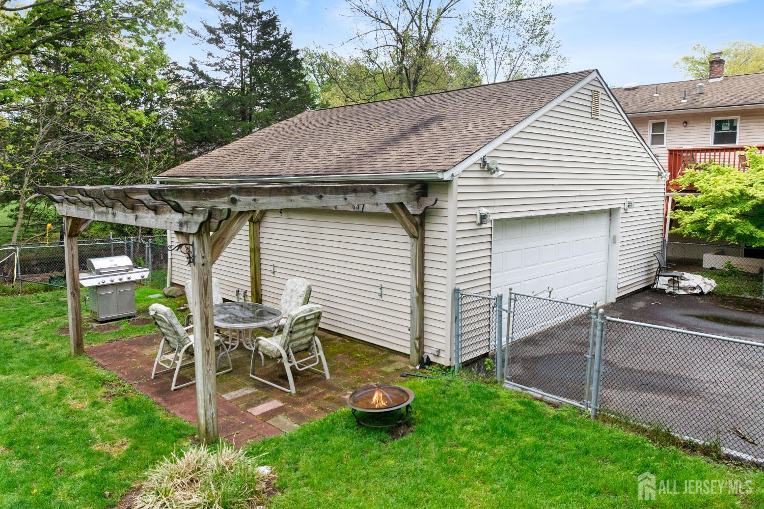 13 Fishel Road Edison, NJ 08820 - Photo 25 of 31 a view of a chair and table in backyard of the house