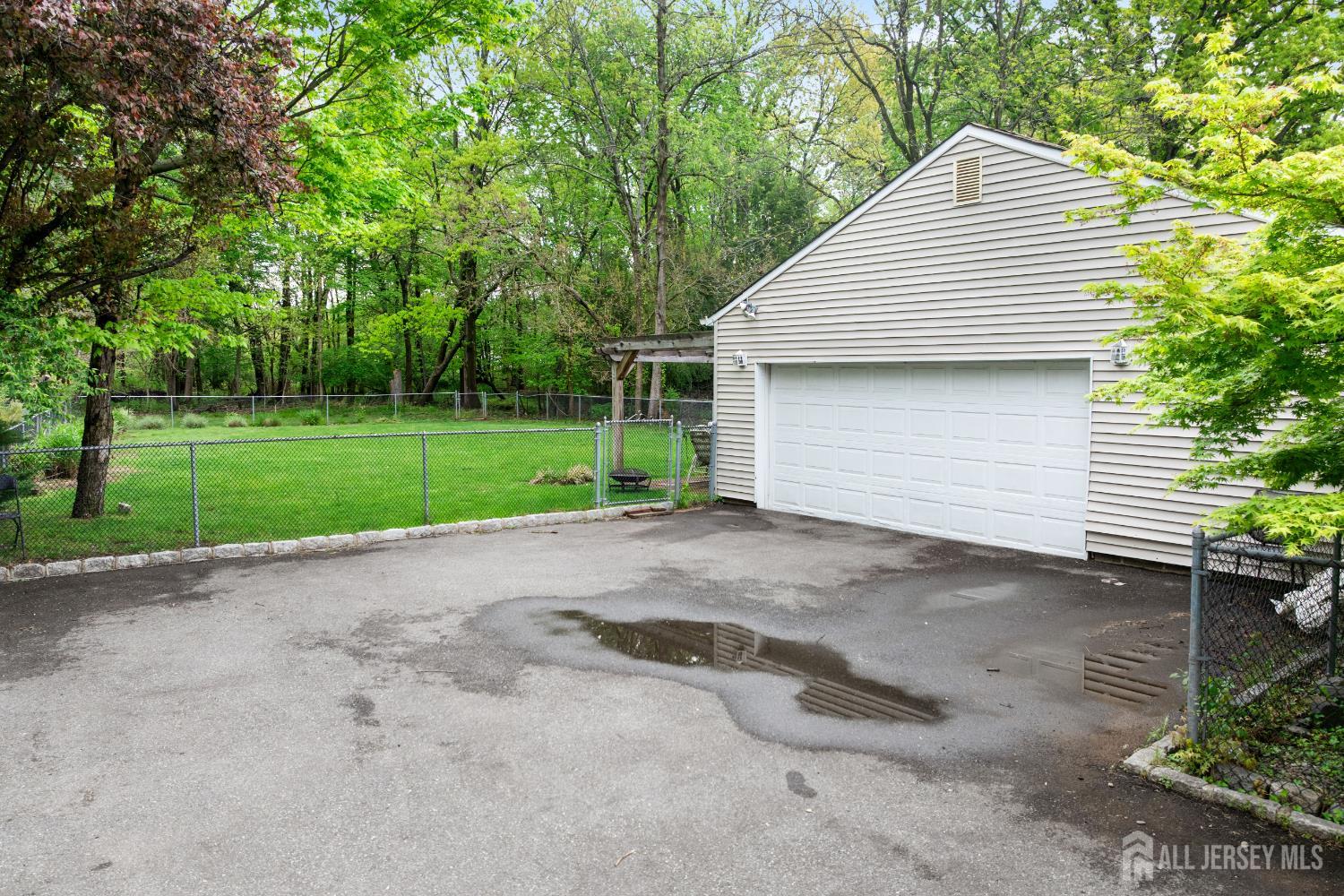 13 Fishel Road Edison, NJ 08820 - Photo 28 of 31 a view of a backyard with large trees