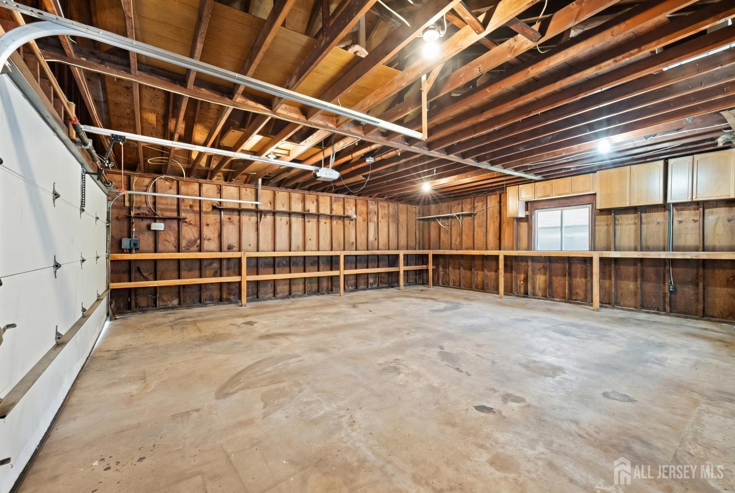 13 Fishel Road Edison, NJ 08820 - Photo 29 of 31 a view of an empty room with wooden shelves