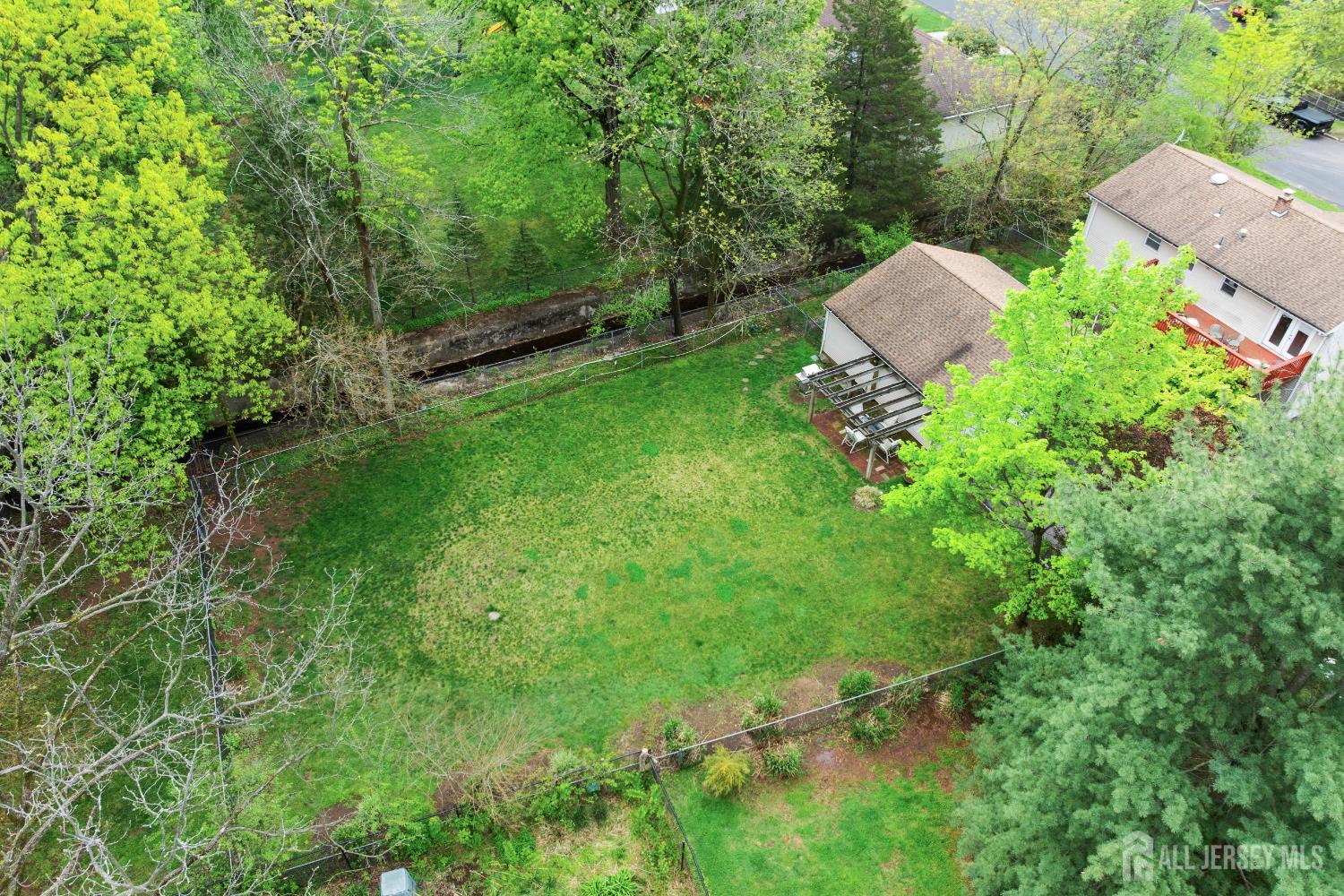 13 Fishel Road Edison, NJ 08820 - Photo 31 of 31 a view of backyard with outdoor seating and green space