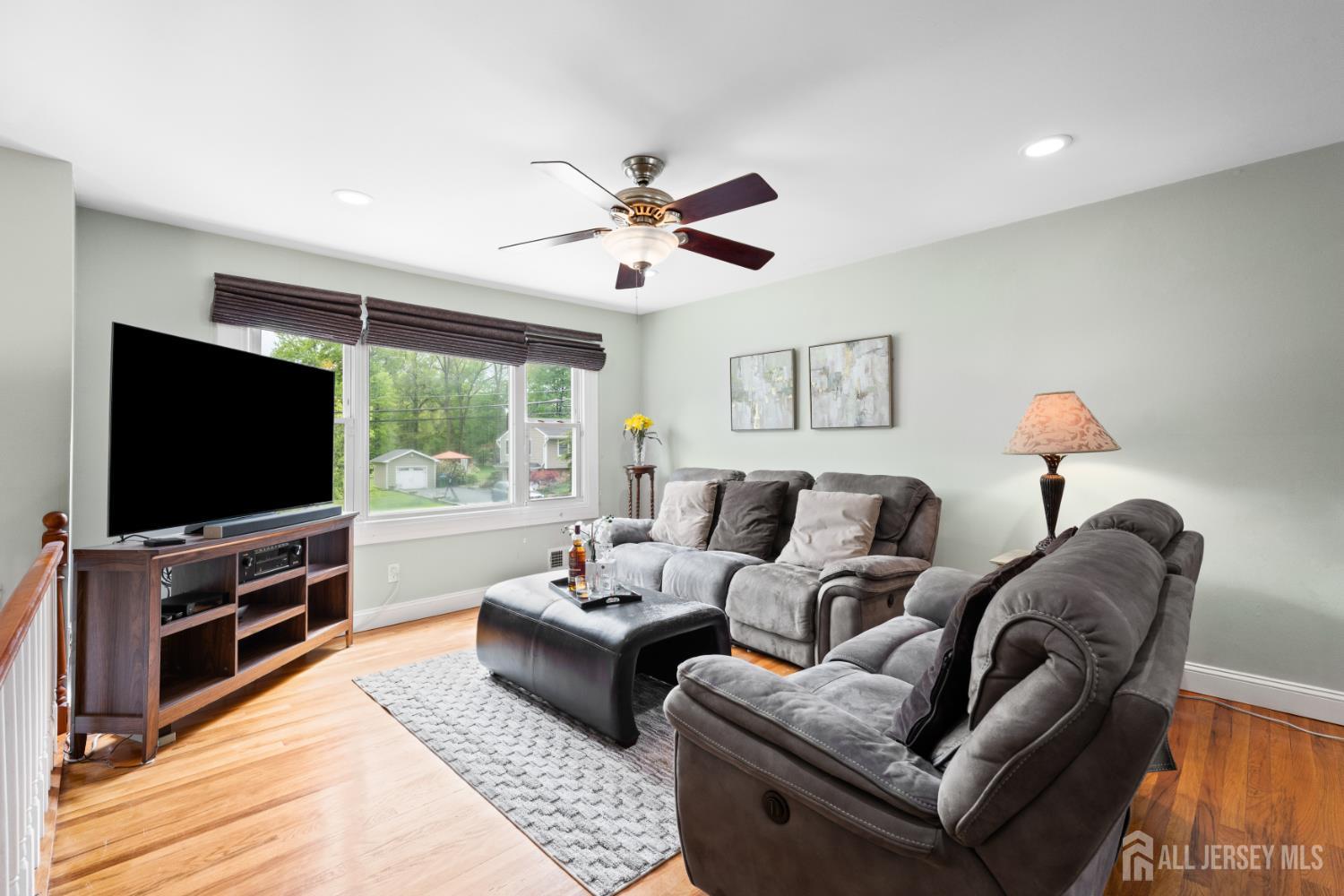 13 Fishel Road Edison, NJ 08820 - Photo 4 of 31 a living room with furniture and a flat screen tv