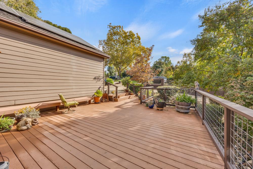 408 Sutter Street Folsom, CA 95630 - Photo 12 of 73 a view of a deck with wooden floor and seating space