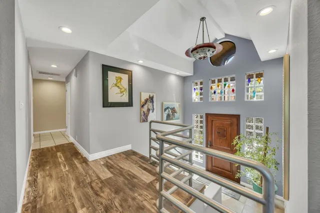 a living room with furniture a fireplace and a large window with outer view