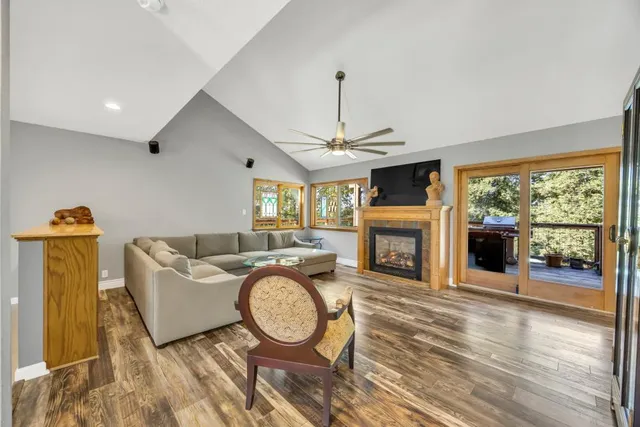 a kitchen with stainless steel appliances granite countertop a stove a sink a microwave a refrigerator and cabinets