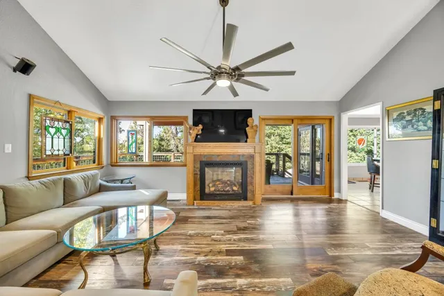 a kitchen with stainless steel appliances granite countertop a sink stove top oven and cabinets