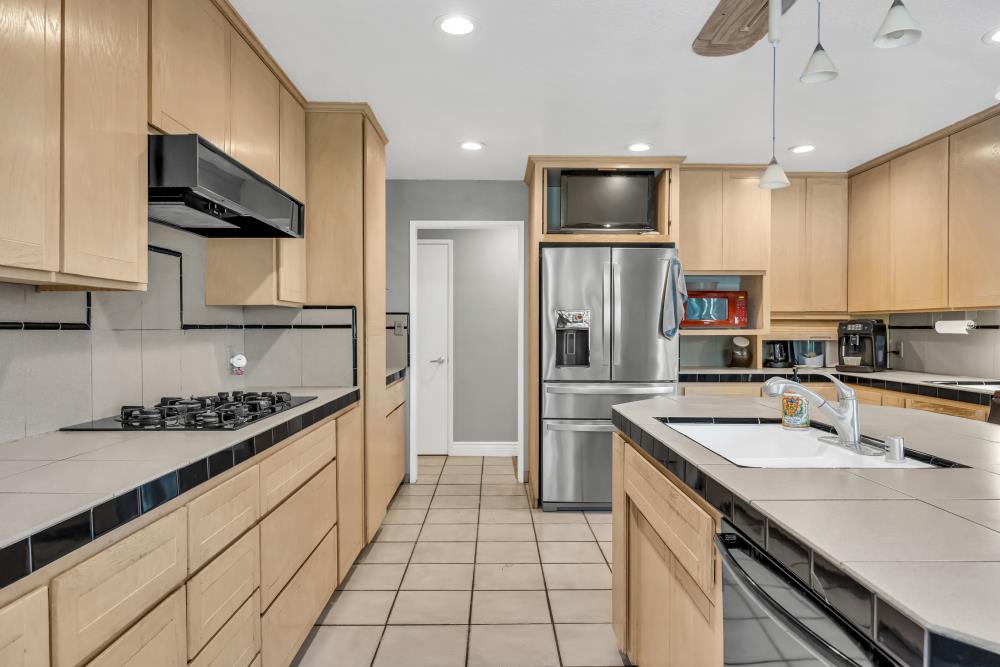 408 Sutter Street Folsom, CA 95630 - Photo 25 of 73 a kitchen with stainless steel appliances a sink stove and refrigerator