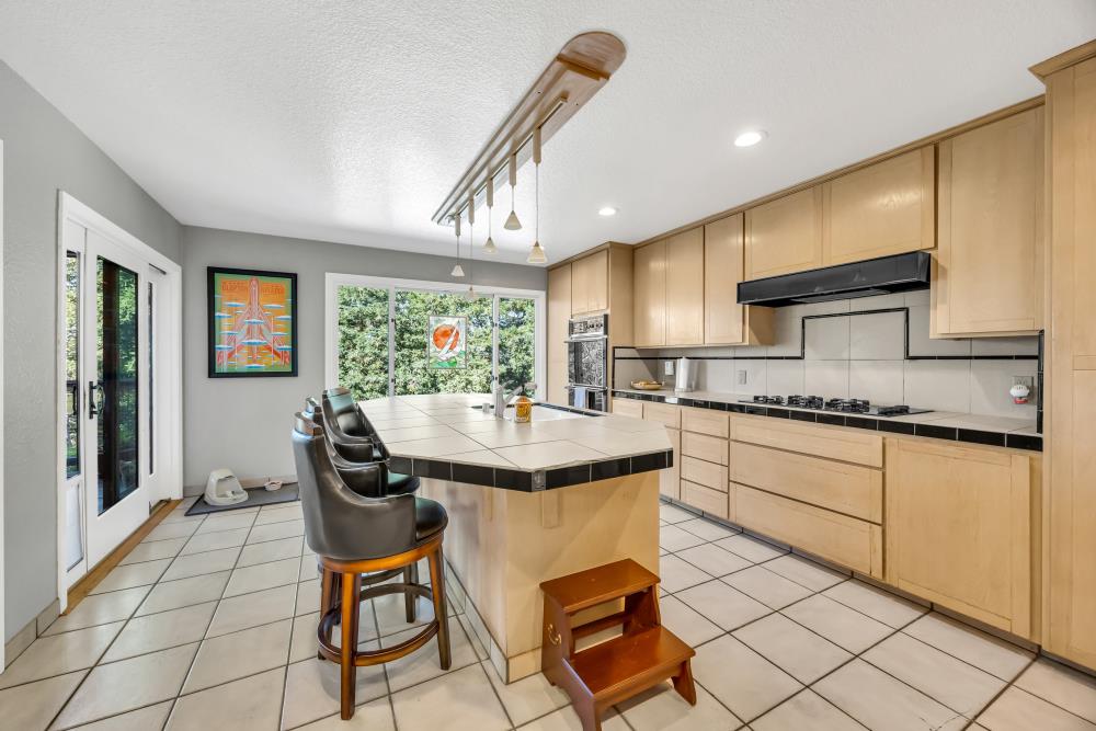 408 Sutter Street Folsom, CA 95630 - Photo 26 of 73 a kitchen with stainless steel appliances granite countertop a stove a sink and a refrigerator