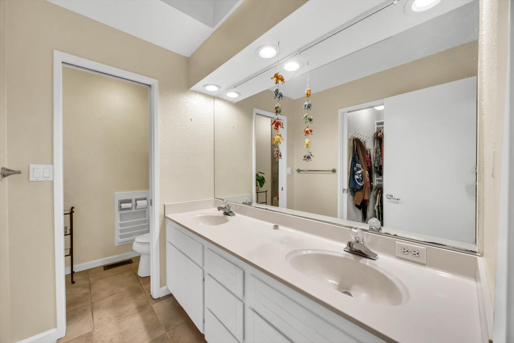 408 Sutter Street Folsom, CA 95630 - Photo 30 of 73 a bathroom with a double vanity sink mirror double and shower