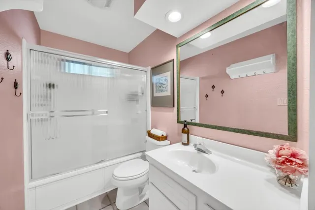 a view of roof deck with table and chairs under an umbrella