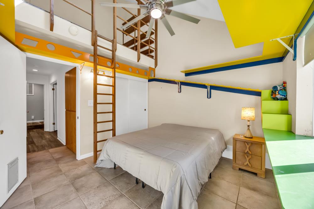 408 Sutter Street Folsom, CA 95630 - Photo 40 of 73 a spacious bedroom with a bed and a chandelier