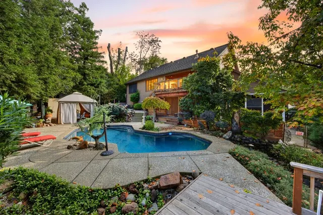 a view of a room with wooden floor and windows