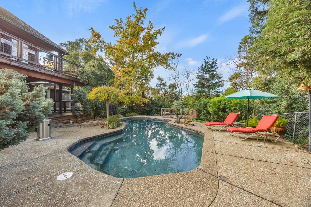 408 Sutter Street Folsom, CA 95630 - Photo 52 of 73 a view of roof deck with table and chairs under an umbrella