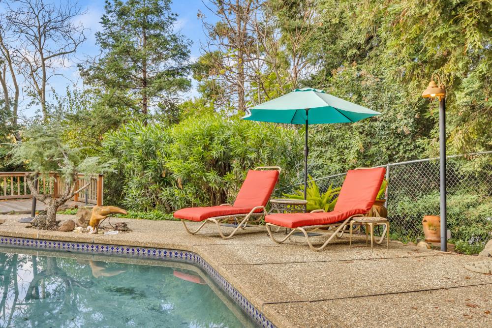 408 Sutter Street Folsom, CA 95630 - Photo 55 of 73 a lawn chairs sitting under a blue umbrella
