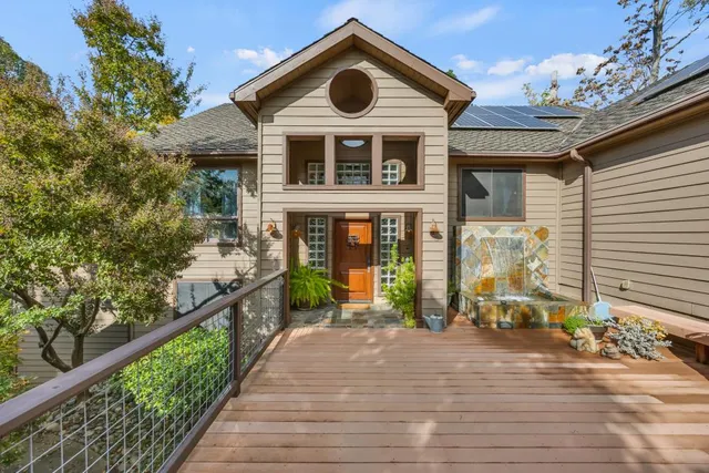 a view of a house with wooden floor and a outdoor space