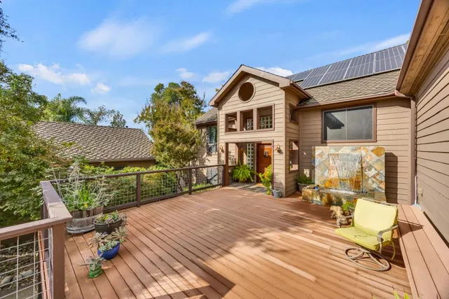 a view of a deck with wooden floor and seating space