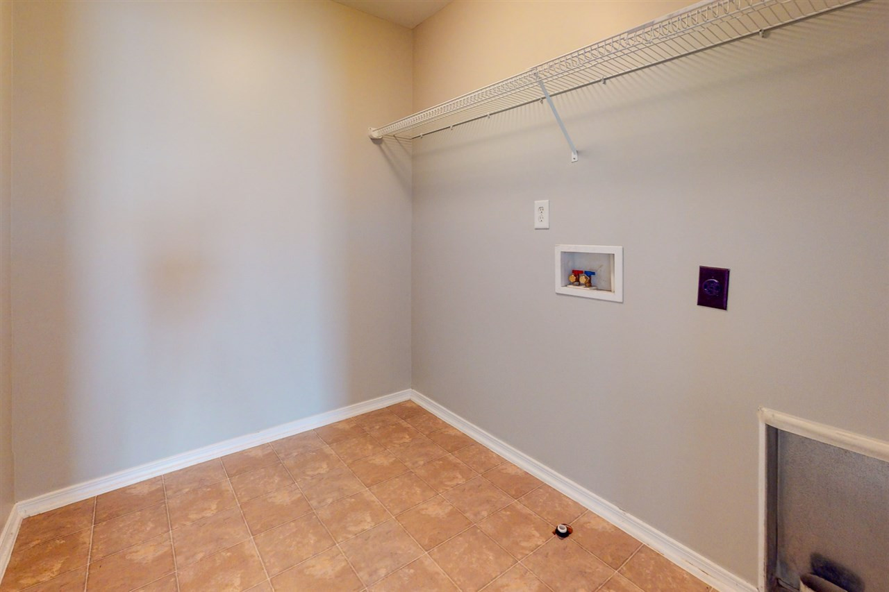 8504 Slabstone Court Raleigh, NC 27613 - Photo 26 of 30 Large laundry room on the second floor and convenient to all bedrooms. Laundry