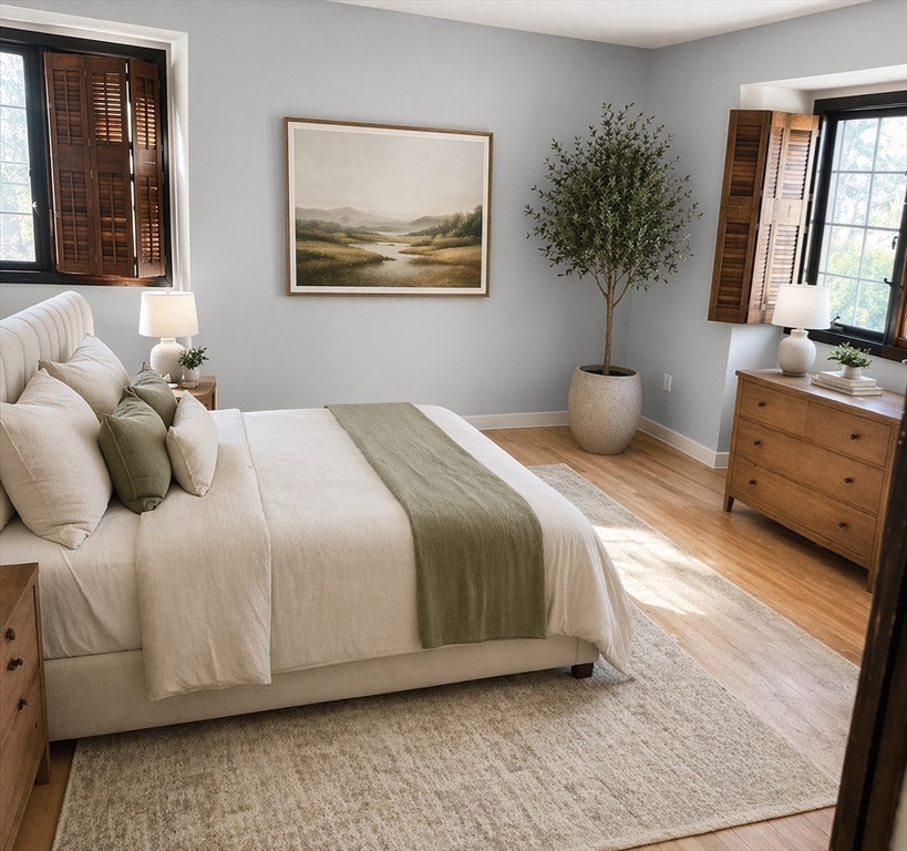 12 Woodland Road Westfield, MA 01085 - Photo 28 of 29 a bedroom with a bed and a potted plant