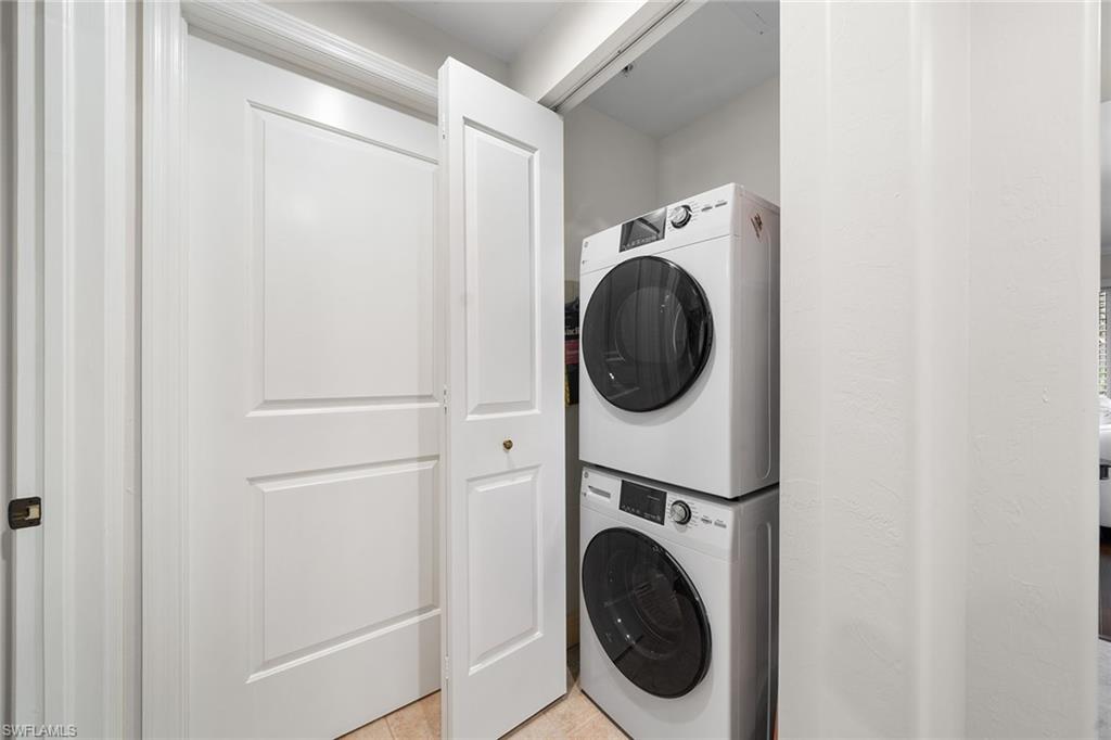 1015 Sandpiper Street, Unit D105 Naples, FL 34102 - Photo 16 of 39 a utility room with dryer and washer