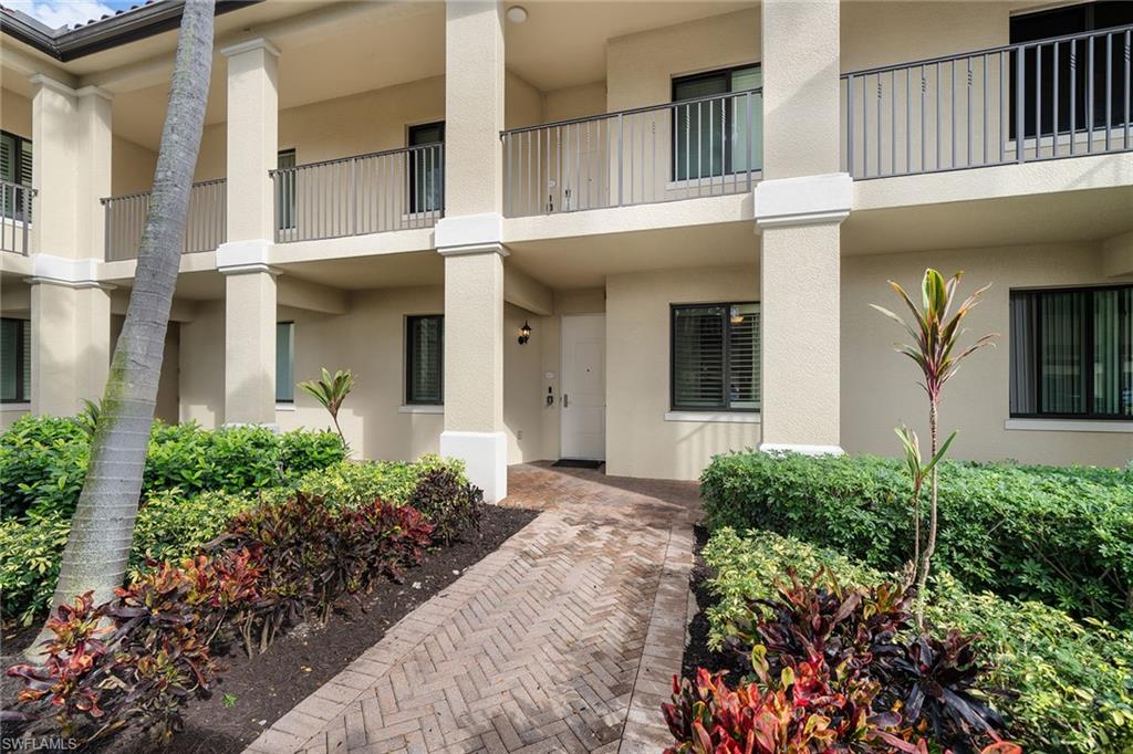1015 Sandpiper Street, Unit D105 Naples, FL 34102 - Photo 2 of 39 front view of a house