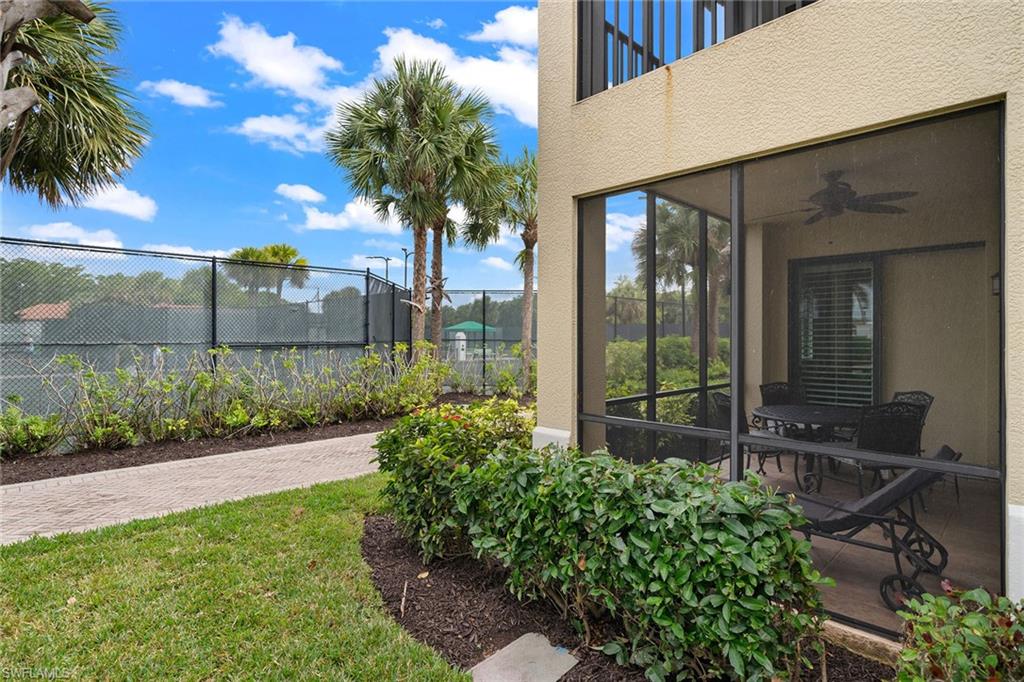 1015 Sandpiper Street, Unit D105 Naples, FL 34102 - Photo 30 of 39 a garden view with a seating space