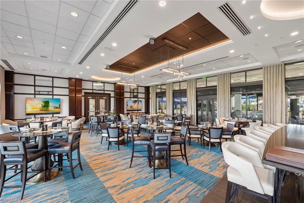 1015 Sandpiper Street, Unit D105 Naples, FL 34102 - Photo 36 of 39 a very nice looking living room with furniture and wooden floor