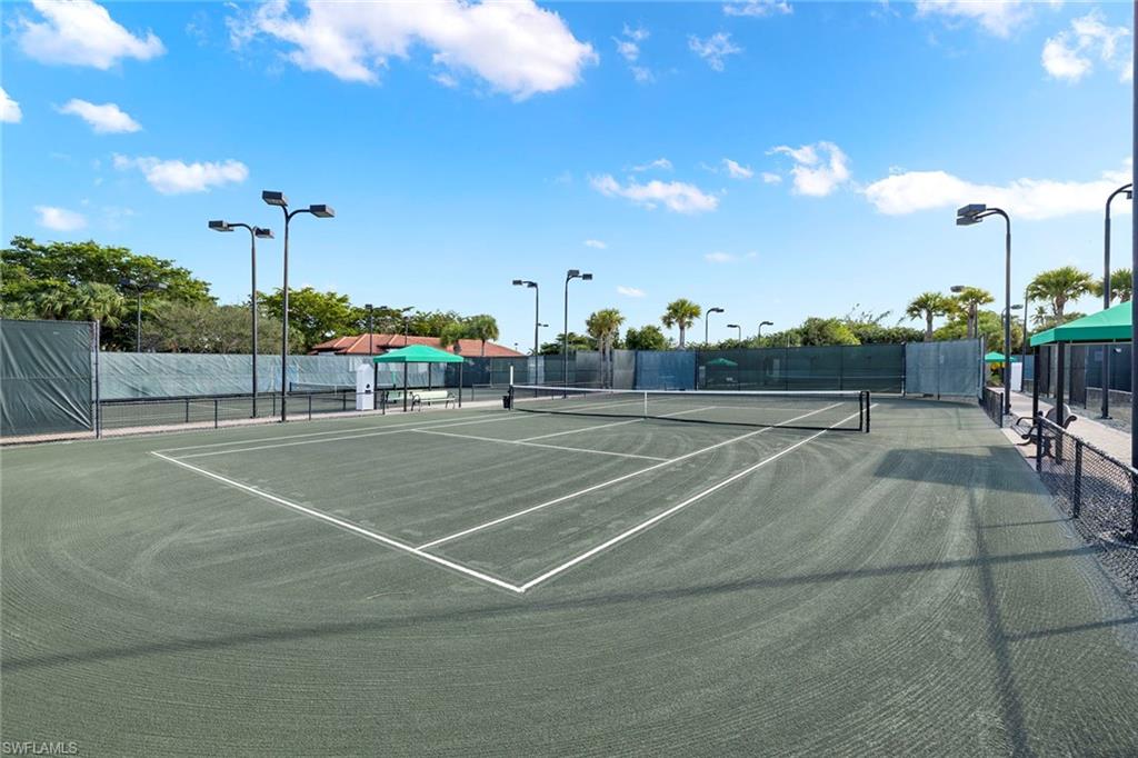 1015 Sandpiper Street, Unit D105 Naples, FL 34102 - Photo 38 of 39 a view of a tennis court