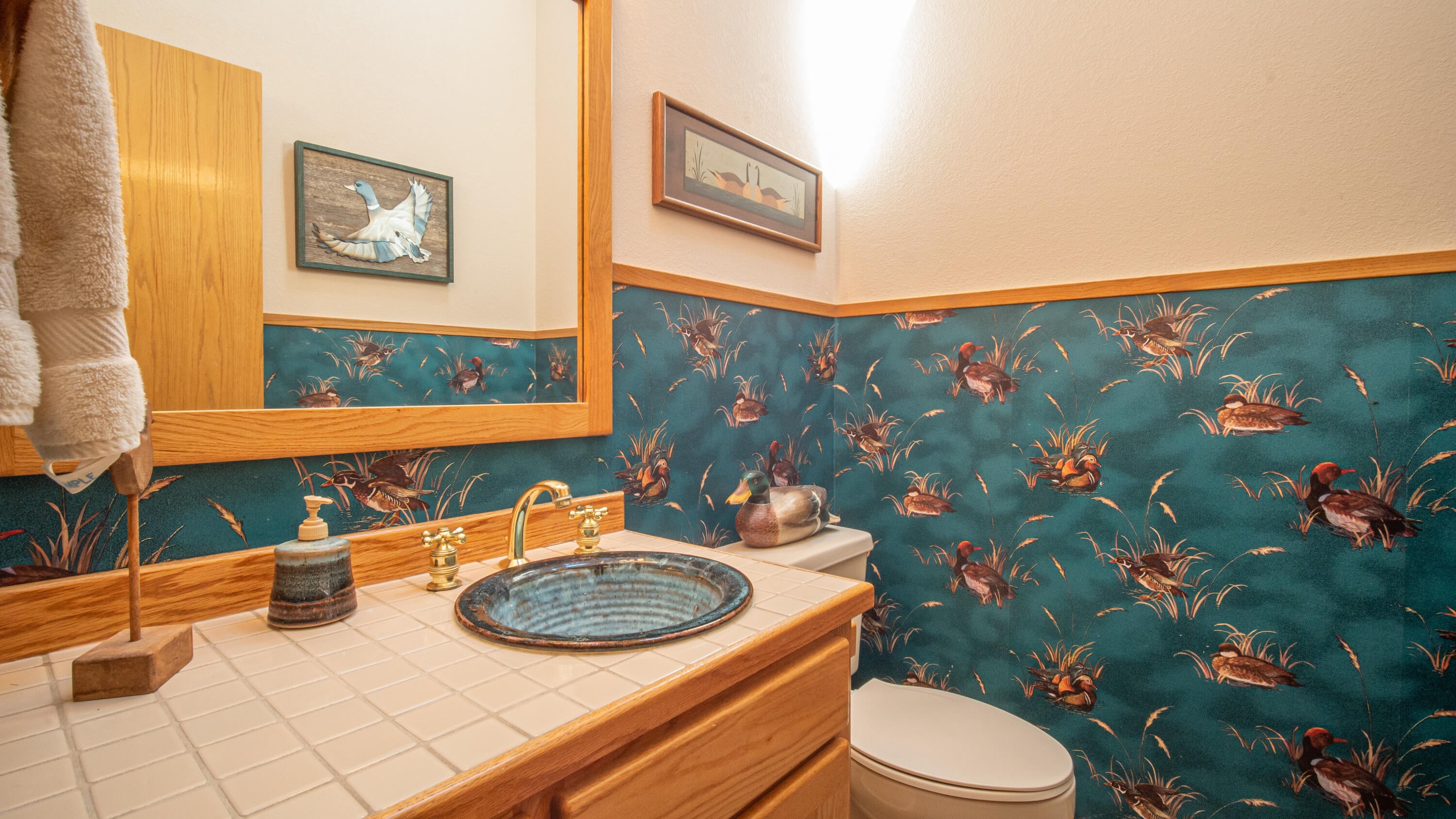 17932 Rhododendron Lane Sunriver, OR 97707 - Photo 20 of 32 There is a powder room off of the Great Room. Perfect for guest use when entertaining.