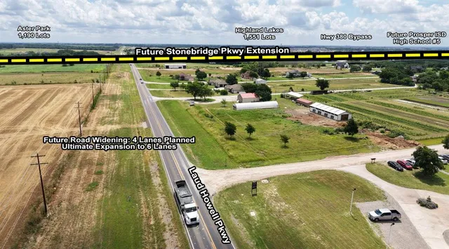 a view of a swimming pool with a yard and plants in the back