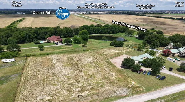 a view of a water fountain and a bench in the background
