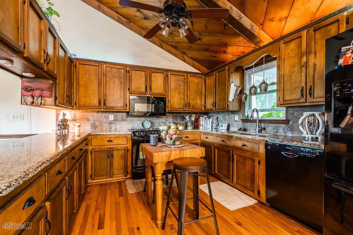 2985 Graham Road Gray, GA 31032 - Photo 2 of 30 a kitchen with stainless steel appliances granite countertop sink stove top oven and cabinets