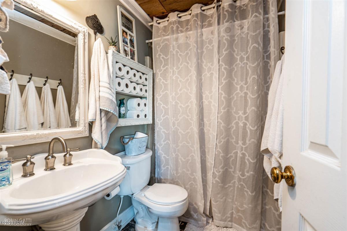 2985 Graham Road Gray, GA 31032 - Photo 18 of 30 a bathroom with a sink toilet and shower