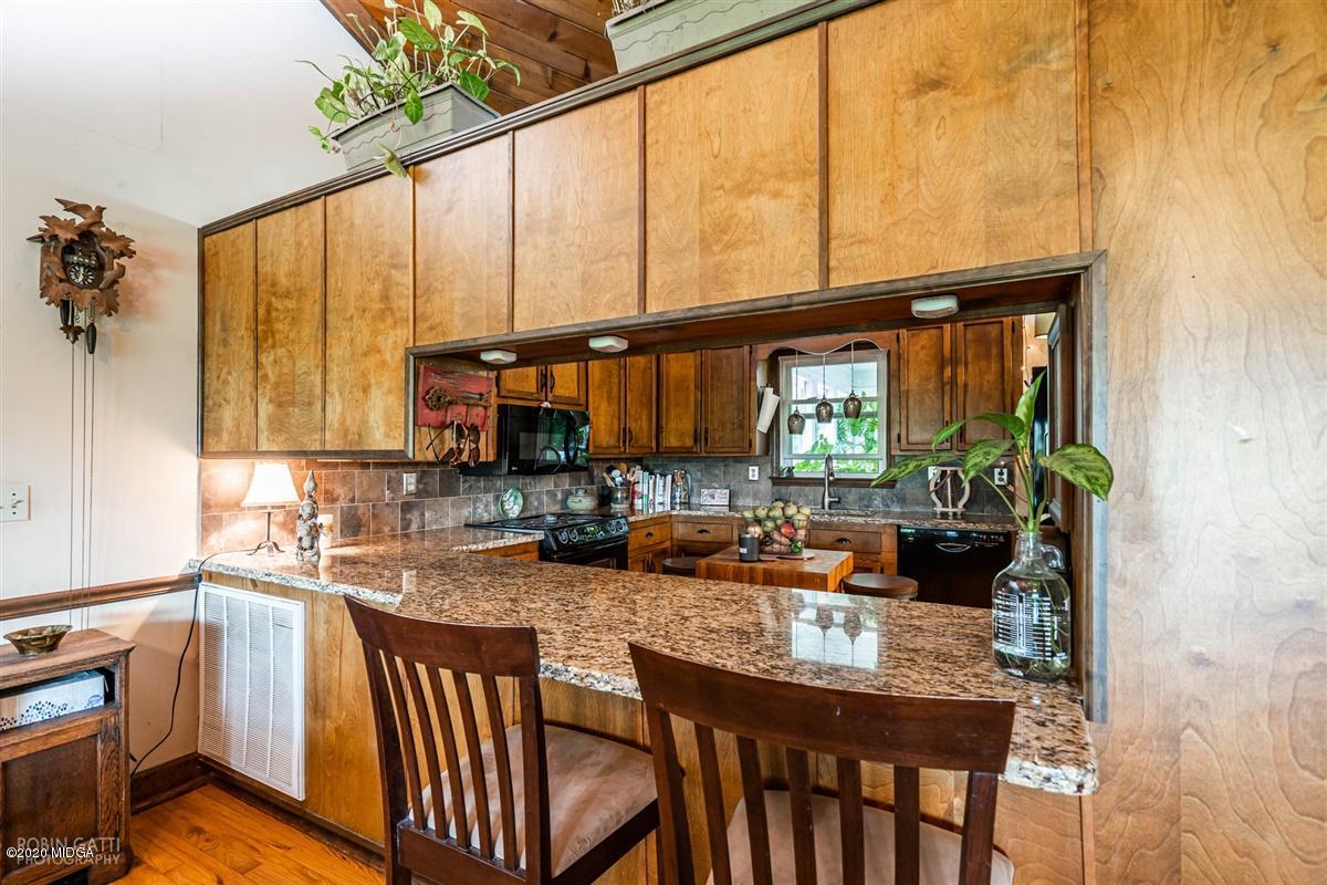 2985 Graham Road Gray, GA 31032 - Photo 3 of 30 a kitchen with sink a window and chairs