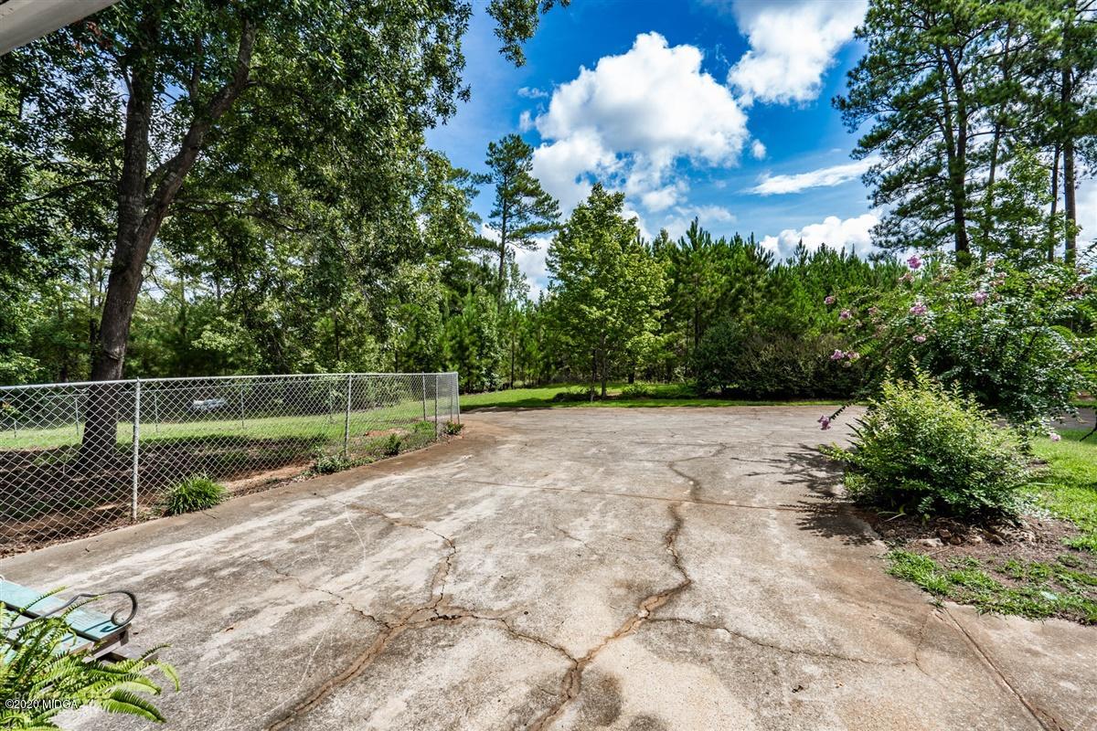 2985 Graham Road Gray, GA 31032 - Photo 23 of 30 a view of a golf course with a lake