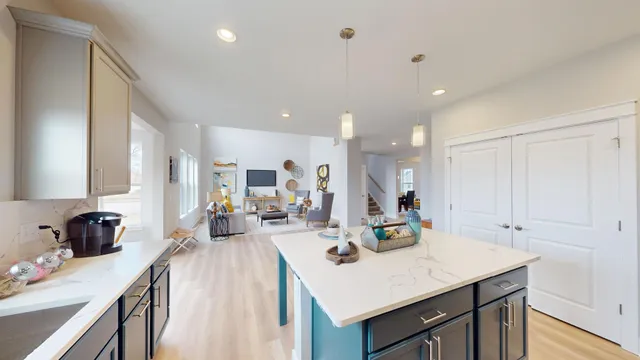 a view of kitchen with sink and living room