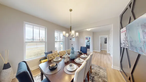 a view of a livingroom with furniture and white walls