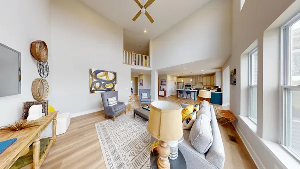 a view of a dining room with furniture wooden floor and a rug