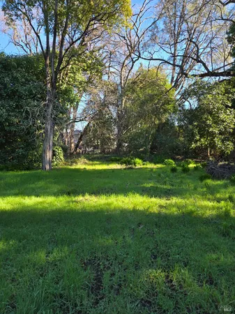 a view of a golf course with a big yard