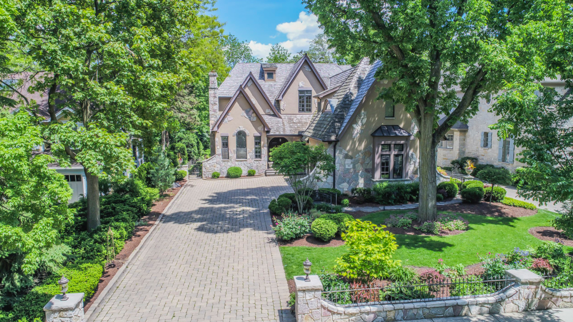 561 Walker Road Hinsdale, IL 60521 - Photo 2 of 41 a front view of a house with a yard and potted plants